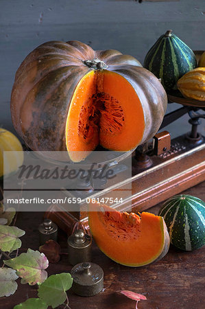 Pumpkins on a wooden table with an old pair of kitchen scales