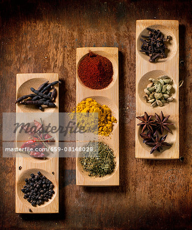 Various spices in wooden dishes (seen from above) Various spices in wooden dishes (seen from above)