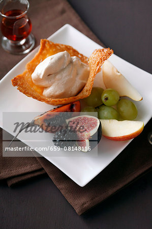 Cinnamon cream in a wafer bowl with fresh fruit Cinnamon cream in a wafer bowl with fresh fruit