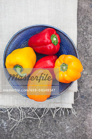 A bowl of colourful peppers (seen from above)