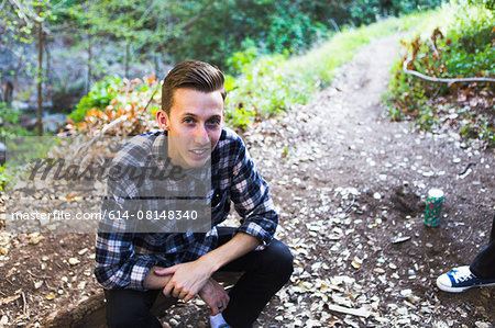 Young man in woods, Upland, California, USA