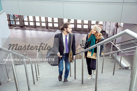 Business people on business trip going up stairs, New York, USA