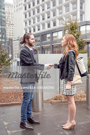 Business people shaking hands, New York, USA