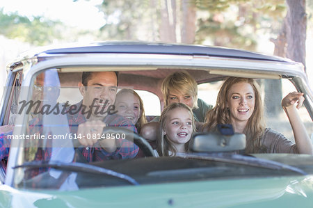 Family in car together, taking road trip