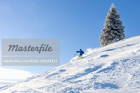 Ski holiday, Man skiing downhill, Sudelfeld, Bavaria, Germany