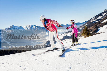 Ski holiday, Mother and daughter skiing, Sudelfeld, Bavaria, Germany