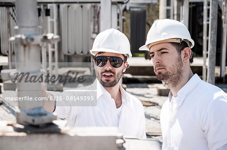 Engineers checking electricity substation