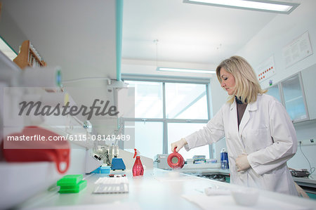 Female scientist doing an experiment in laboratory