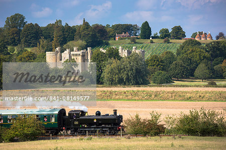 Steam train of the Kent and East Sussex Railway and Bodiam Castle, a National Trust tourist attraction, East Sussex, England, United Kingdom, Europe