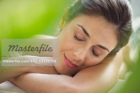 Woman resting head on arms