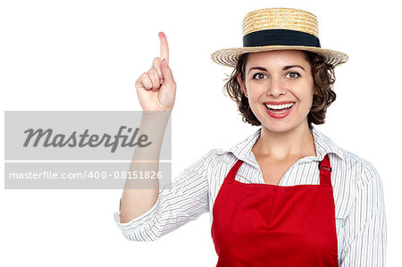 Attractive young lady dressed as chef.