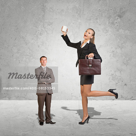 Lagre Young Businesswoman and small Businessman. Concrete background