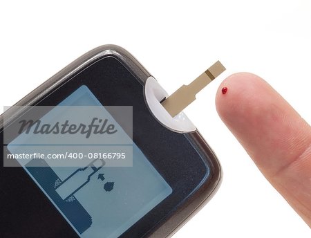 Glucometer test strips and finger with a drop of blood