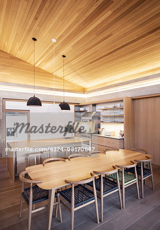 Illuminated slanted wood ceiling over kitchen Illuminated slanted wood ceiling over kitchen