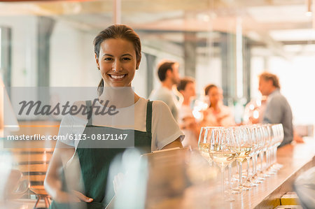 Portrait smiling winery tasting room worker