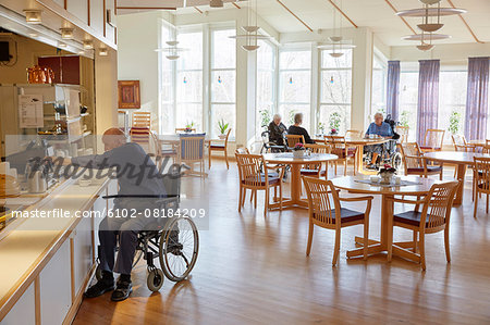 Senior man having coffee in dining room