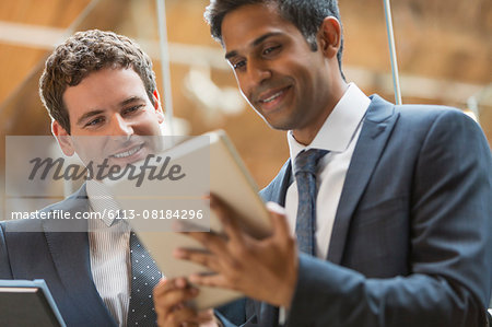 Businessmen working with digital tablet in office