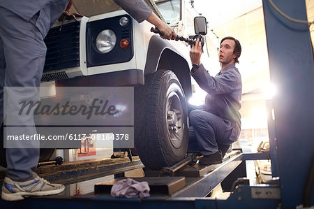 mechanics working in auto repair shop mechanics working in auto repair shop