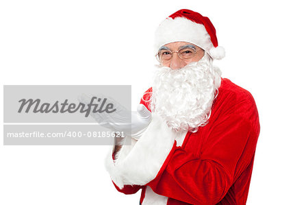 Happy Santa Claus smiling with open palms. Looking at camera.