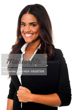 Female executive in formals holding business files