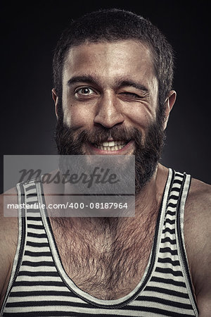 Portrait of a bearded man on dark background