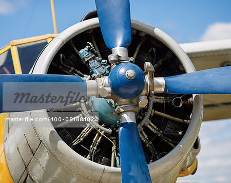 Propeller and airplane engine close-up. Shallow depth of field. Selective focus on propeller.
