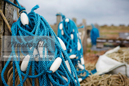 Close up of a tangle of blue fisherman's rope with white floats.