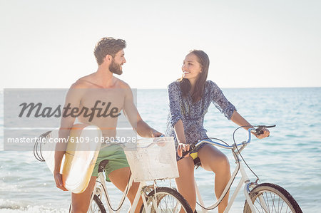 Happy couple going on a bike ride