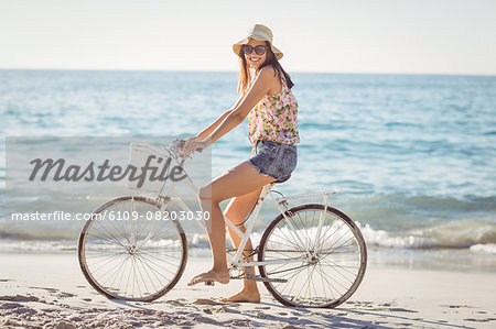 Pretty brunette woman on a bike ride