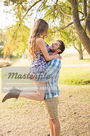 Cute couple hugging in the park