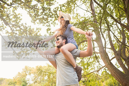 Handsome man carrying his girlfriend