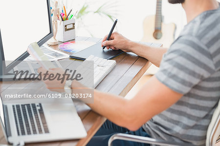 Graphic designer using a graphics tablet