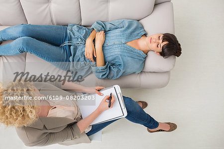 Psychologist talking with her depressed patient