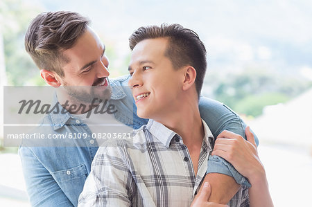 Homosexual couple men looking at each other