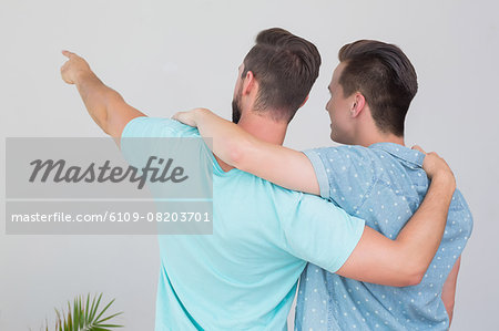 Wear view of homosexual couple looking away