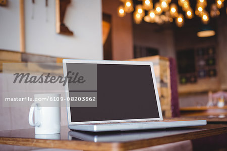 Laptop on a wooden table