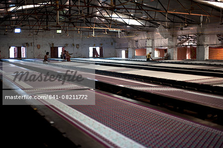 Screenprinting factory, men printing sari lengths of cotton by hand, Bhuj district, Gujarat, India, Asia