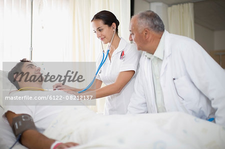 Doctor and nurse tending to patient