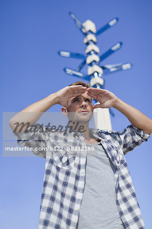 Man admiring view at crossroads