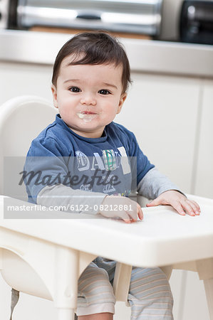 Baby boy smiling with messy mouth