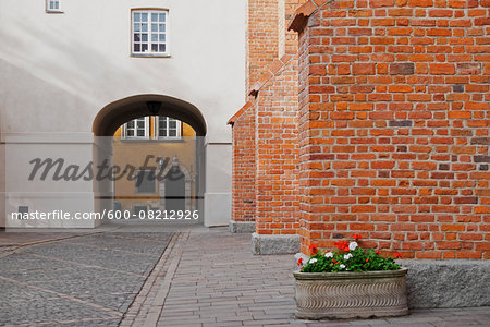 Planter by Brick Wall and Passage through Building, Stare Miasto, Warsaw, Poland Planter by Brick Wall and Passage through Building, Stare Miasto, Warsaw, Poland