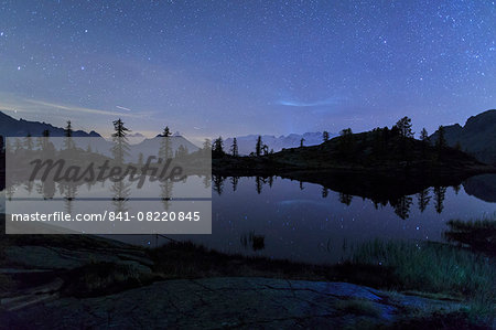 Starry night on Mount Rosa seen from Lake Vallette, Natural Park of Mont Avic, Aosta Valley, Graian Alps, Italy, Europe