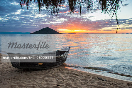 Fishing boat at sunset at Cape Malcear, Lake Malawi, Malawi, Africa