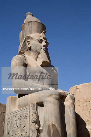 Statue of seated Ramses II, Court of Ramses II, Luxor Temple, Luxor, Thebes, UNESCO World Heritage Site, Egypt, North Africa, Africa