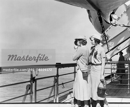 1930s TWO WOMEN FILMING WITH 8MM HOME MOVIE CAMERA ON DECK OF TRANSATLANTIC OCEAN LINER SHIP