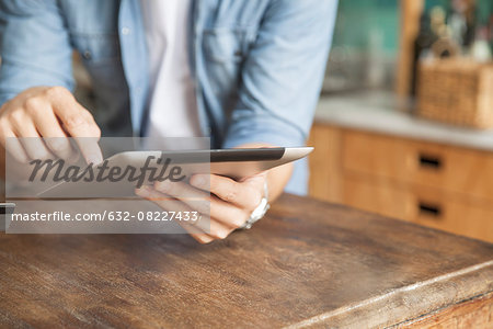 Man using wireless device at home