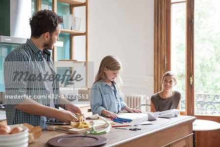 Family spending time together in kitchen