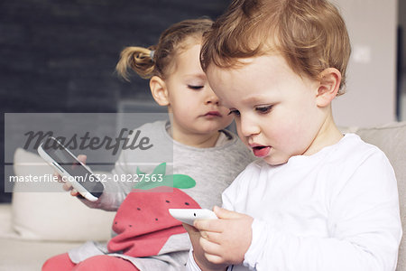 Children playing with smartphones