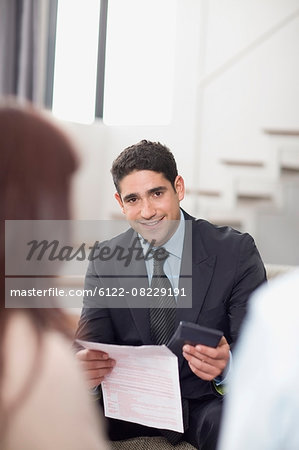Businessman working with couple