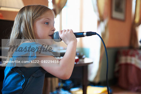 Girl singing into microphone